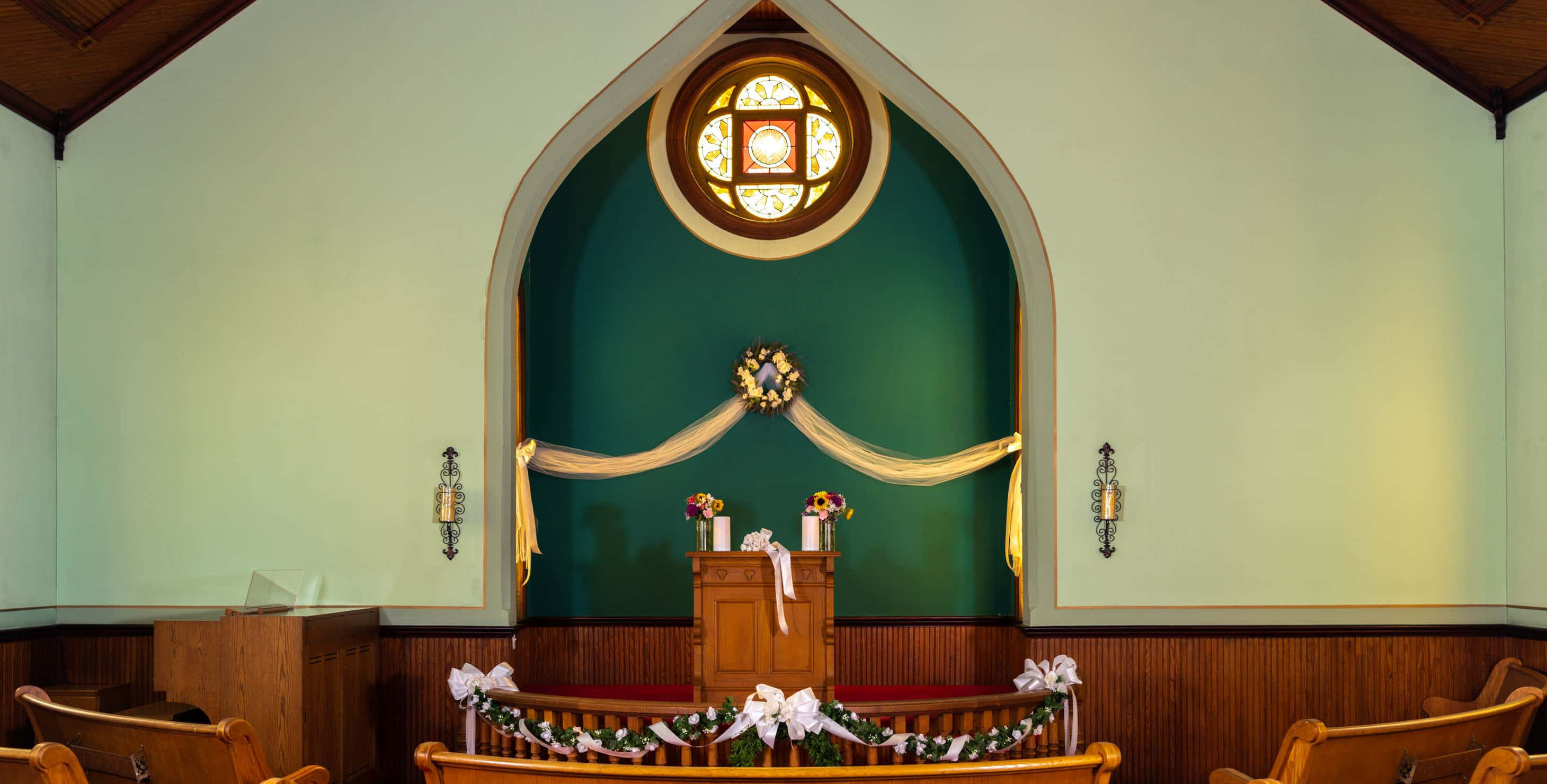 Ashby Chapel interior altar and stained glass window