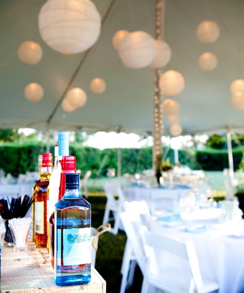 Wedding tent with tables and lights